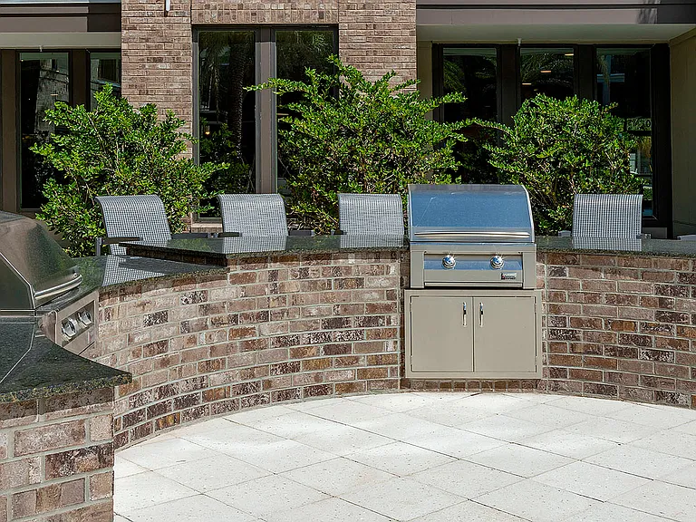 Experience outdoor dining luxury with this stylish kitchen setup, perfect for entertaining.