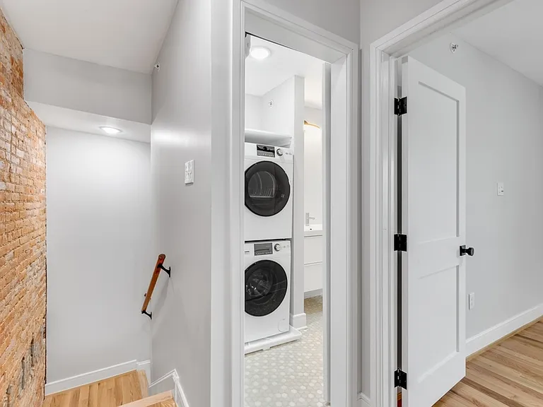 At the top of the stairs is a full bathroom.