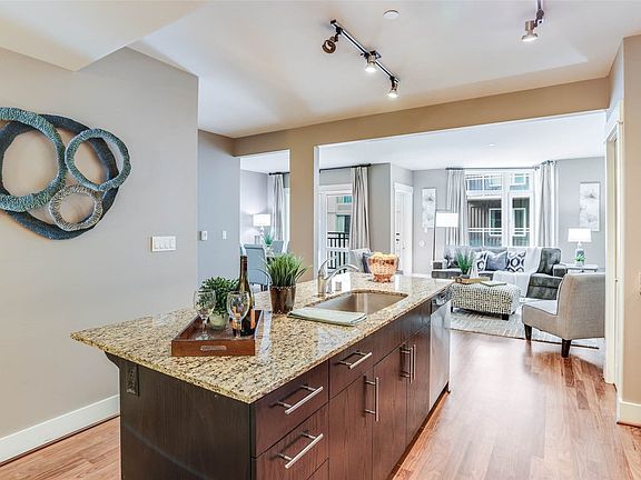 Center island kitchen with pantry and full size stainless steel appliances>