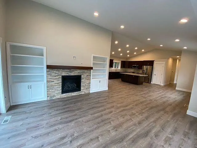 Living room with gas fireplace and custom cabinets