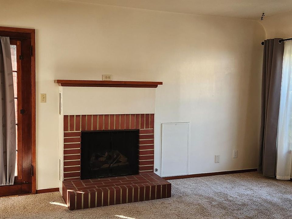 Newly renovated fireplace with gas insert.