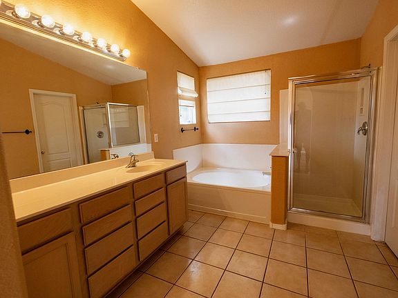 Large bright master bathroom with larger walking closet