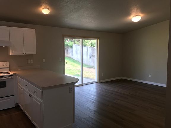 Dining room/family room with fenced back yard access.