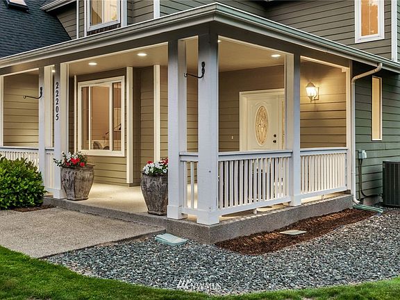 An oversized covered front porch is a welcoming touch to this wonderful home, and provides added open air living - rain or shine.