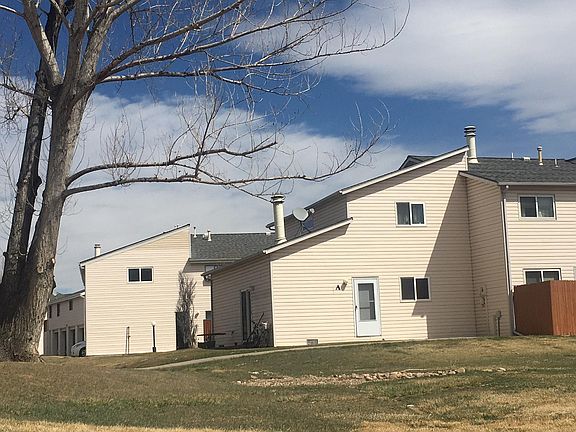 South facing door ,Private End Unit abuts Grassy areas with beautiful trees and views!