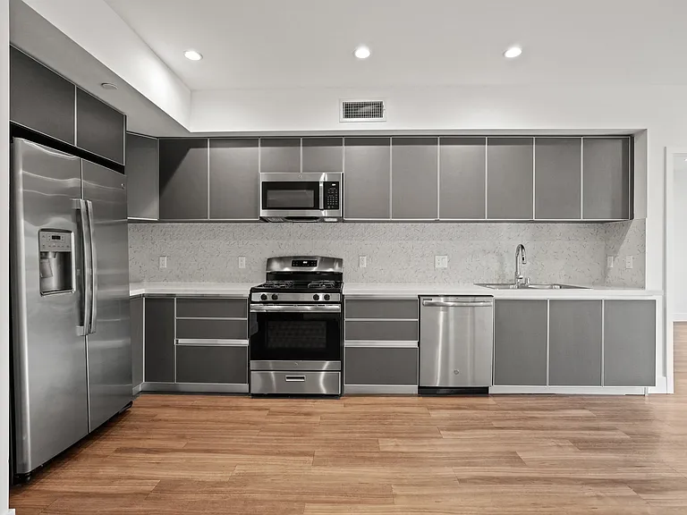Kitchen with Stainless Refrigerator, Stove, Microwave Oven, and Dishwasher