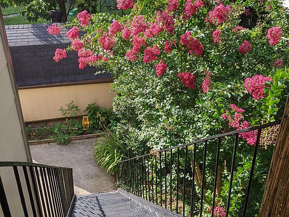 Private entrance through beautiful manicured lawn.