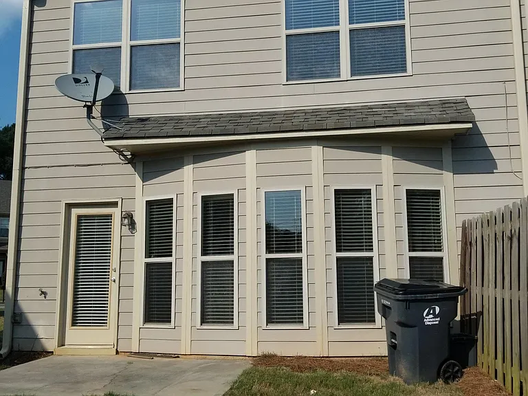Rear view showing Bay Windows, Patio and big backyard with l