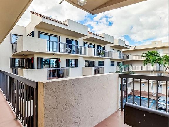 Airy balcony overlooking the pool