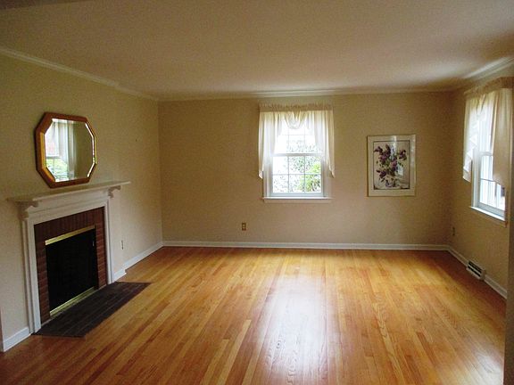 Neutral and spacious living room with fireplace