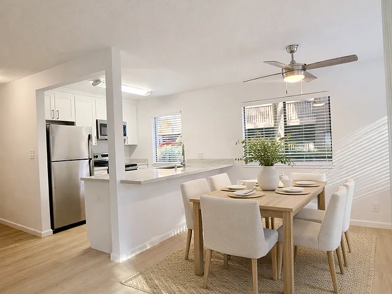 Dining Area and Kitchen - Remodeled Unit - AI Staged