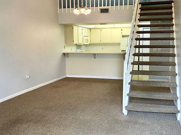 Open living and dining area with high cathedral ceilings!