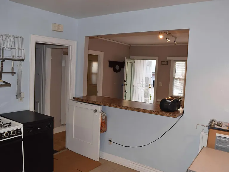 Living room and front door (picture taken from the kitchen)