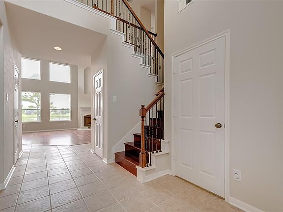 Views of the backyard lake can be seen from the house's main entry.