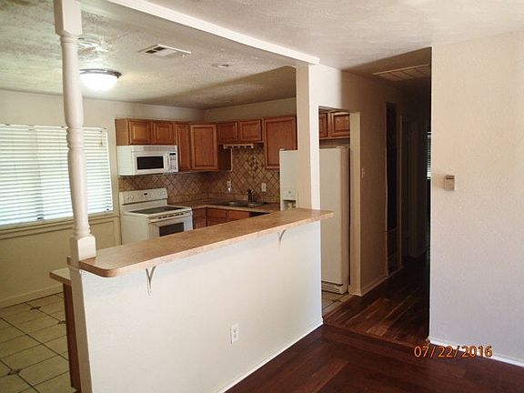 Living room looking into kitchen