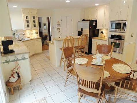 Stainless steel appliances, recessed lighting, & tile floors!