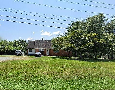 front of house showing huge front yard lib