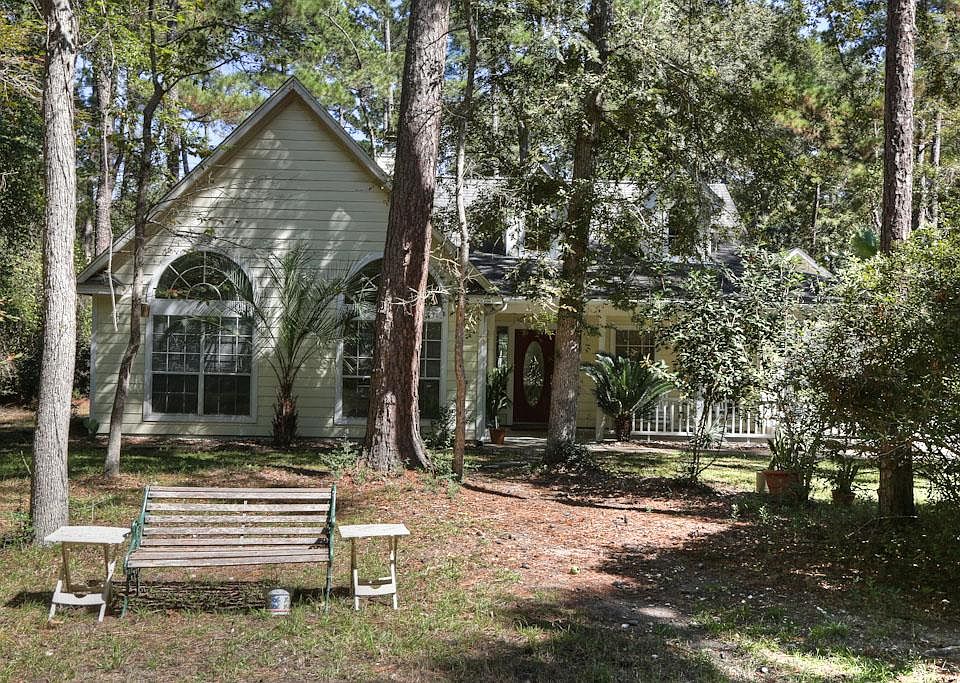 heavily wooded lot offers ultimate privacy