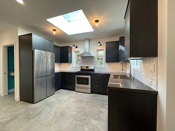 Bright, Airy Kitchen with All New Stainless Appliances & Massive Skylight