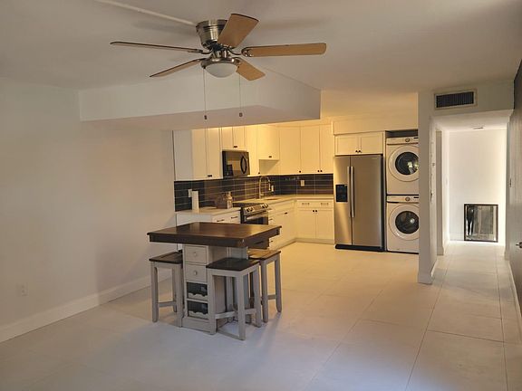 Kitchen with dining table set (optional).