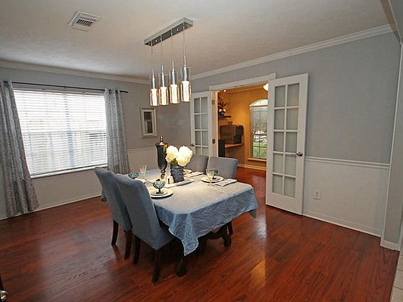 Step into this lovely 2 story home and to your right is the formal dining room. Notice the French doors...this space is perfect for an office or even a craft room.