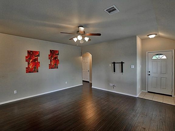 Beautiful laminate wood flooring is featured throughout the house along with ceramic tile.