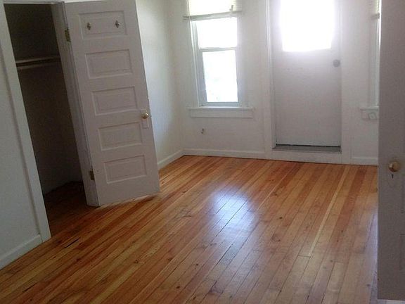 bedroom view with 2nd closet and view of balcony enterance
