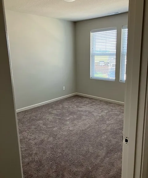 secondary bedroom A (one of the secondary bedrooms facing street)