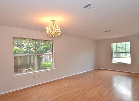Formal Living and Dining with Beautiful Floors and New Interior Paint