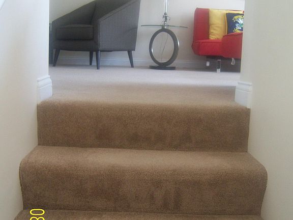 Top of foyer stairs going into main living room