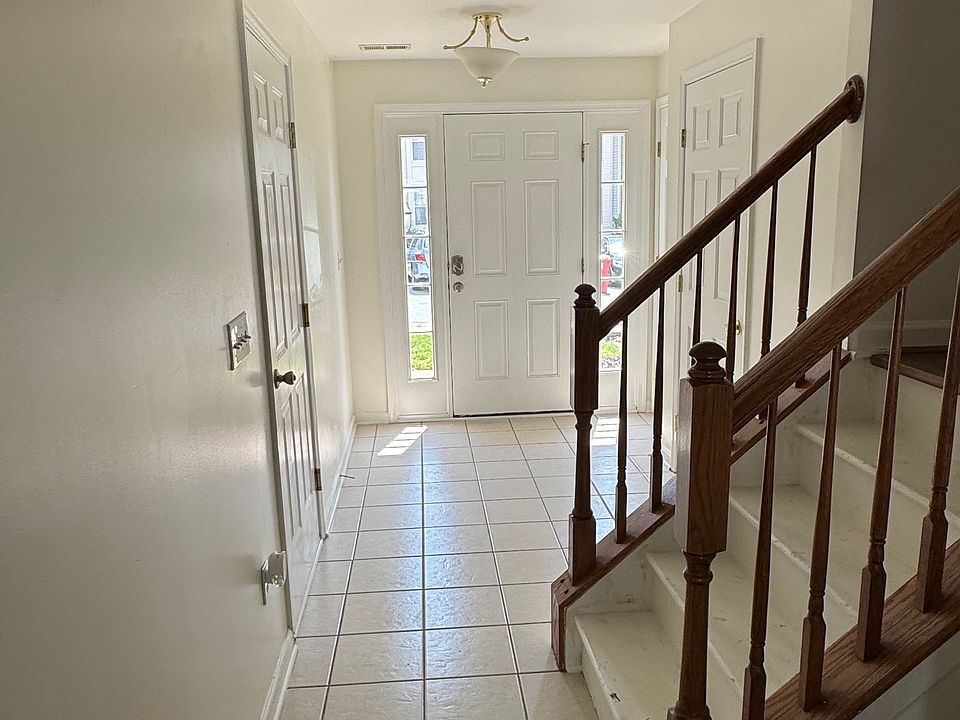 Foyer, powder room, coat closet, and garage door.