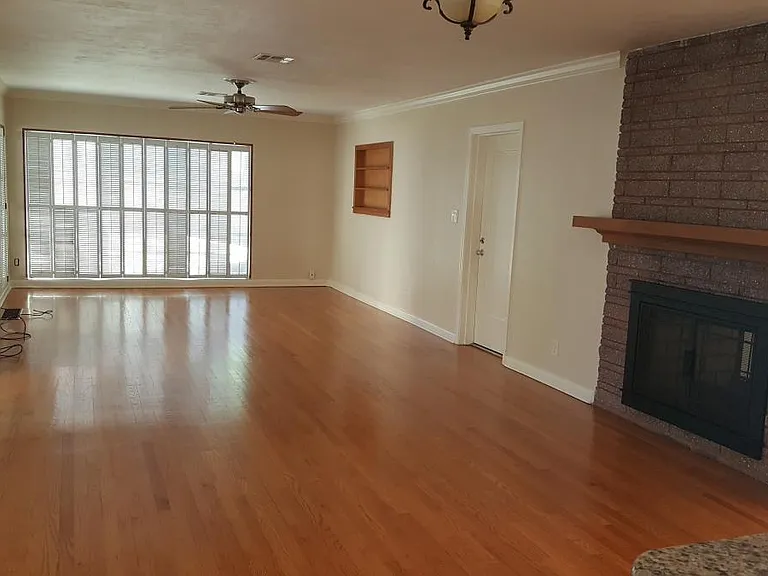 View from kitchen to family room and fireplace