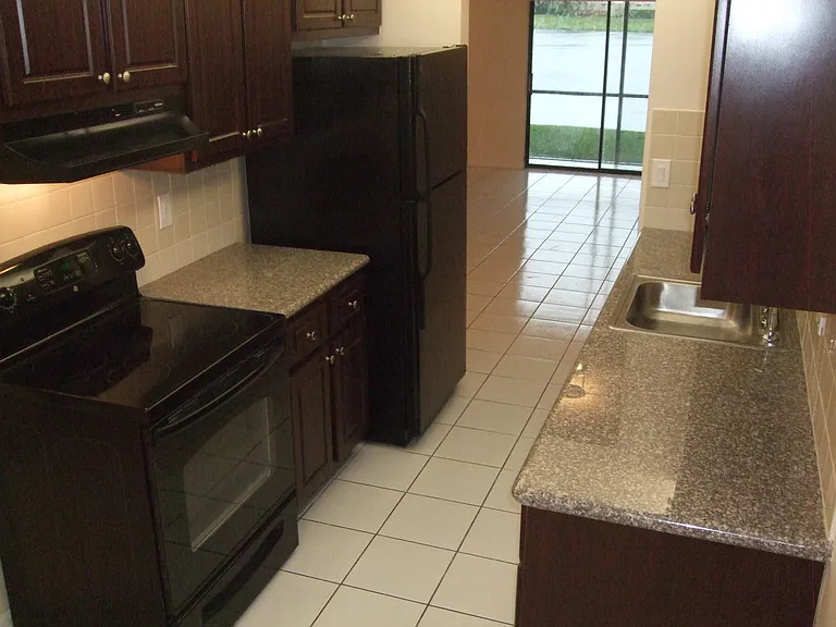 Kitchen looking into living room
New cabinets granite countertops
Dishwasher, stove, refrigerator