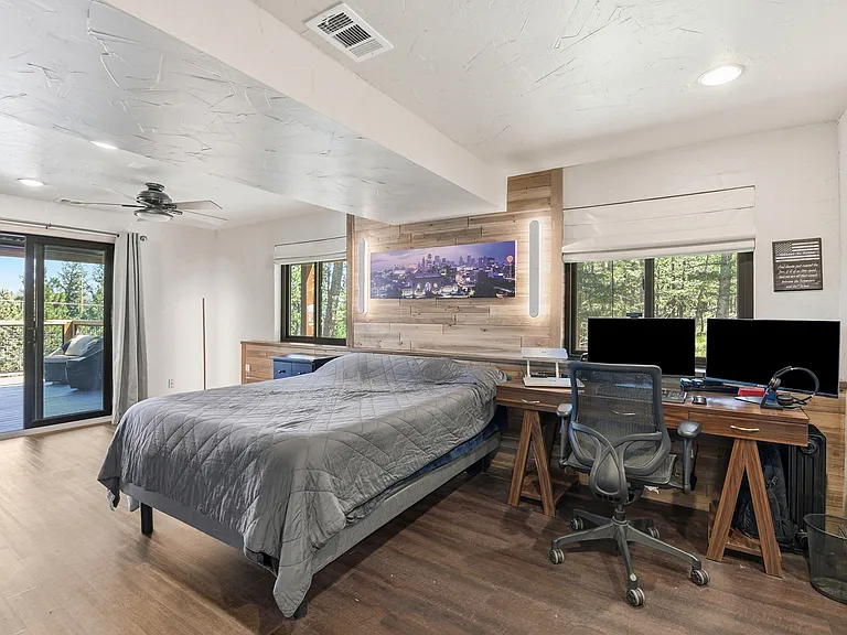 Retreat to an oversized primary suite featuring custom finishes, a dedicated office space, walk-in closet, and direct access to your own private deck.