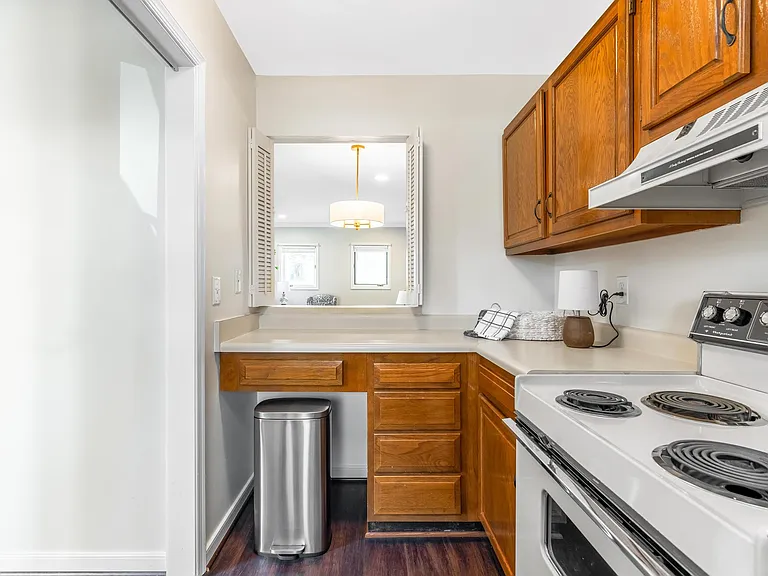 Kitchen area also includes a small area that can be used as a desk, if desired.