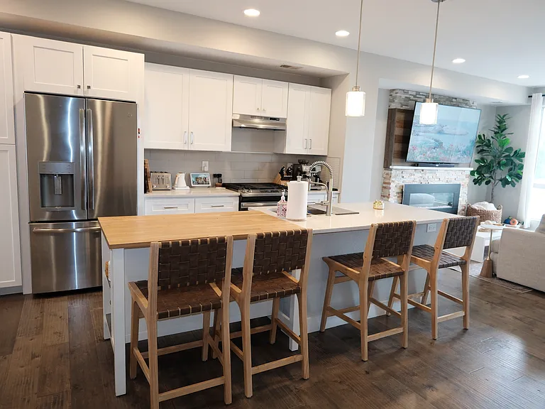 Large kitchen island, pantry, and upgraded appliances