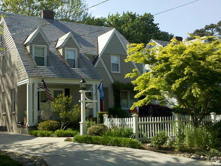 Front of house from driveway side; large front porch