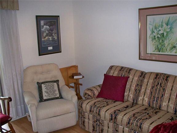 Living room with laminate flooring   Unit is partially furnished