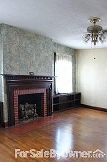 Living Room
						:
						Built-in bookcases and gas fireplace. Hardwood floor