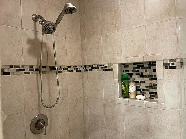 Walk in stall shower in the Master Bathroom. Beautifully tiled.