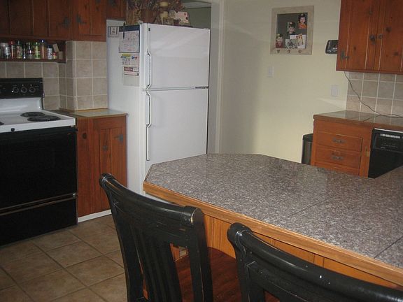 Kitchen with Granite Tile Counter Tops