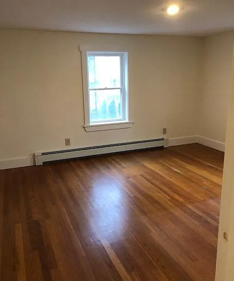 Three Bedrooms Located On Second Floor All With Hardwood Flooring And A Closet In Each Room