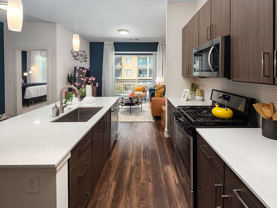 Contemporary Apartment Interior Featuring Designer Kitchen and Connected Living Space
