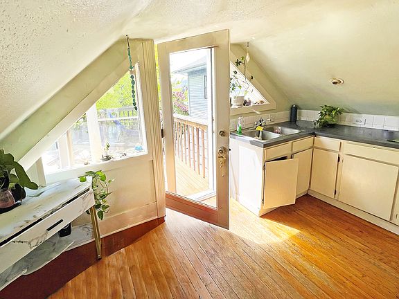 Inside front door, windows, kitchen
