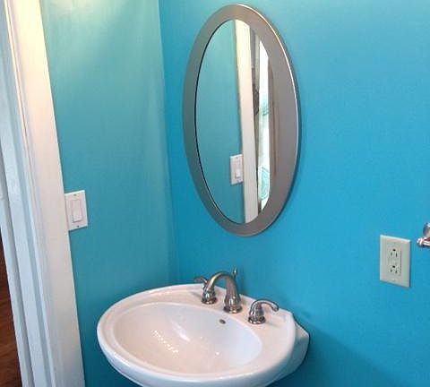 First floor half bath sink and lighting.