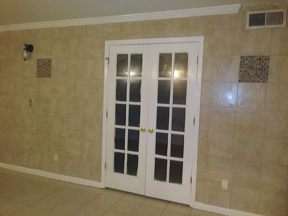 Front room with french doors that lead to bedroom 1