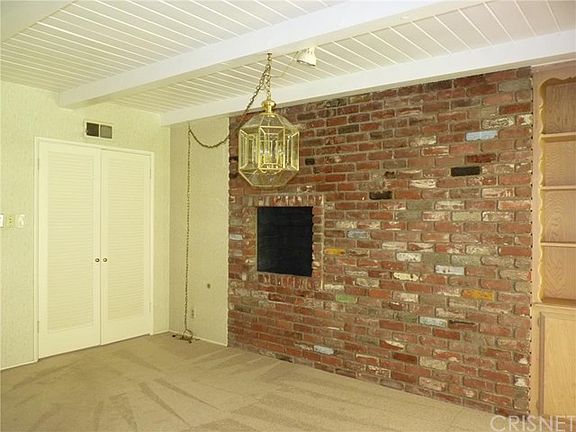 Dining Room has Built-In BBQ and Display Shelves