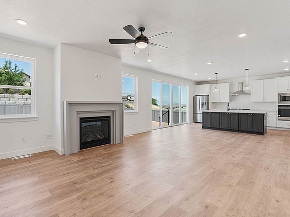 The family room is large and has lots of windows and a gas fireplace.