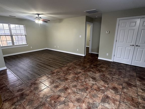 Dining area and closet with washer and dryer connections.
