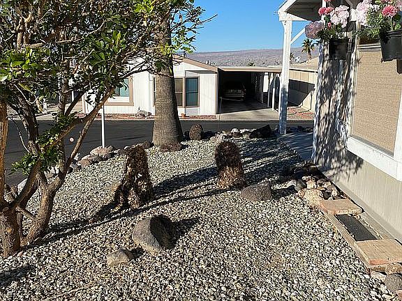 Side view in front of house.